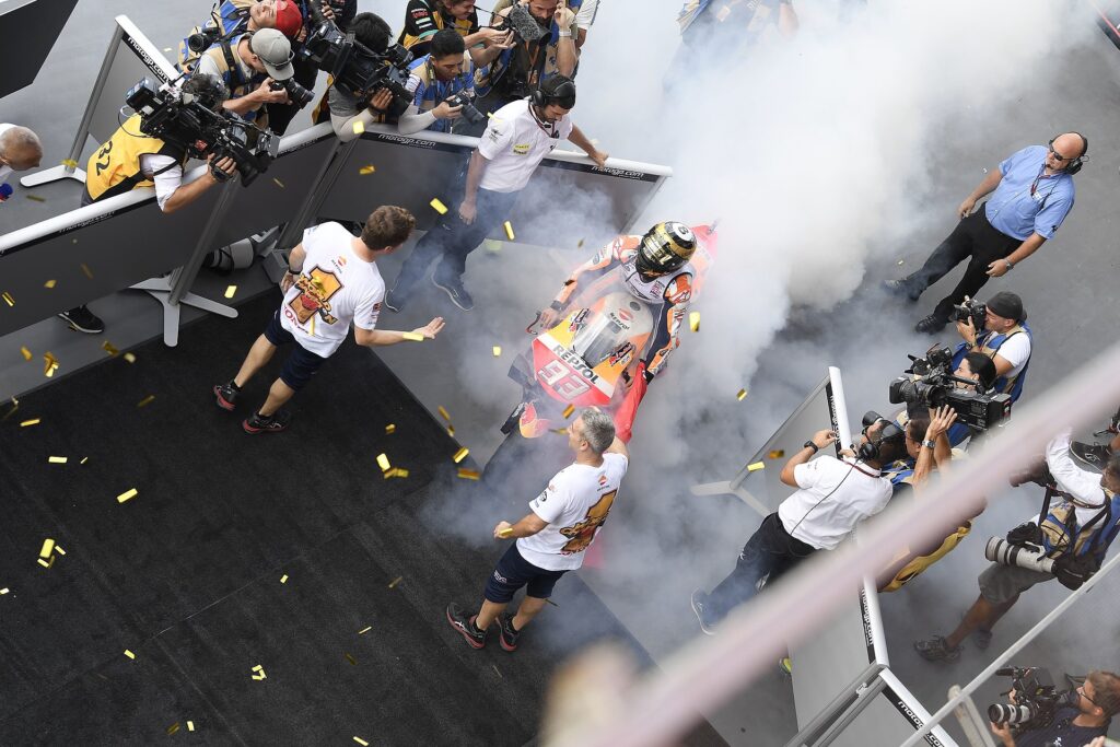 Marc Márquez performs a burnout on his Repsol Honda after winning the 2019 Thailand MotoGP and his sixth world championship at Chang International Circuit, Buriram