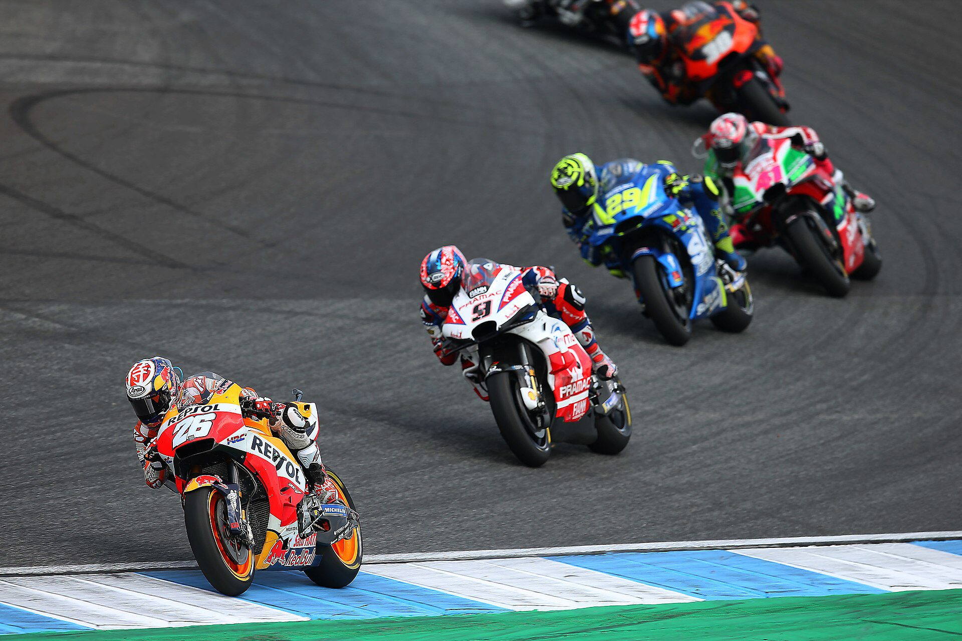 The field heads into Turn 1 at the 2018 MotoGP Thailand — the first Grand Prix at Chang International Circuit, Buriram