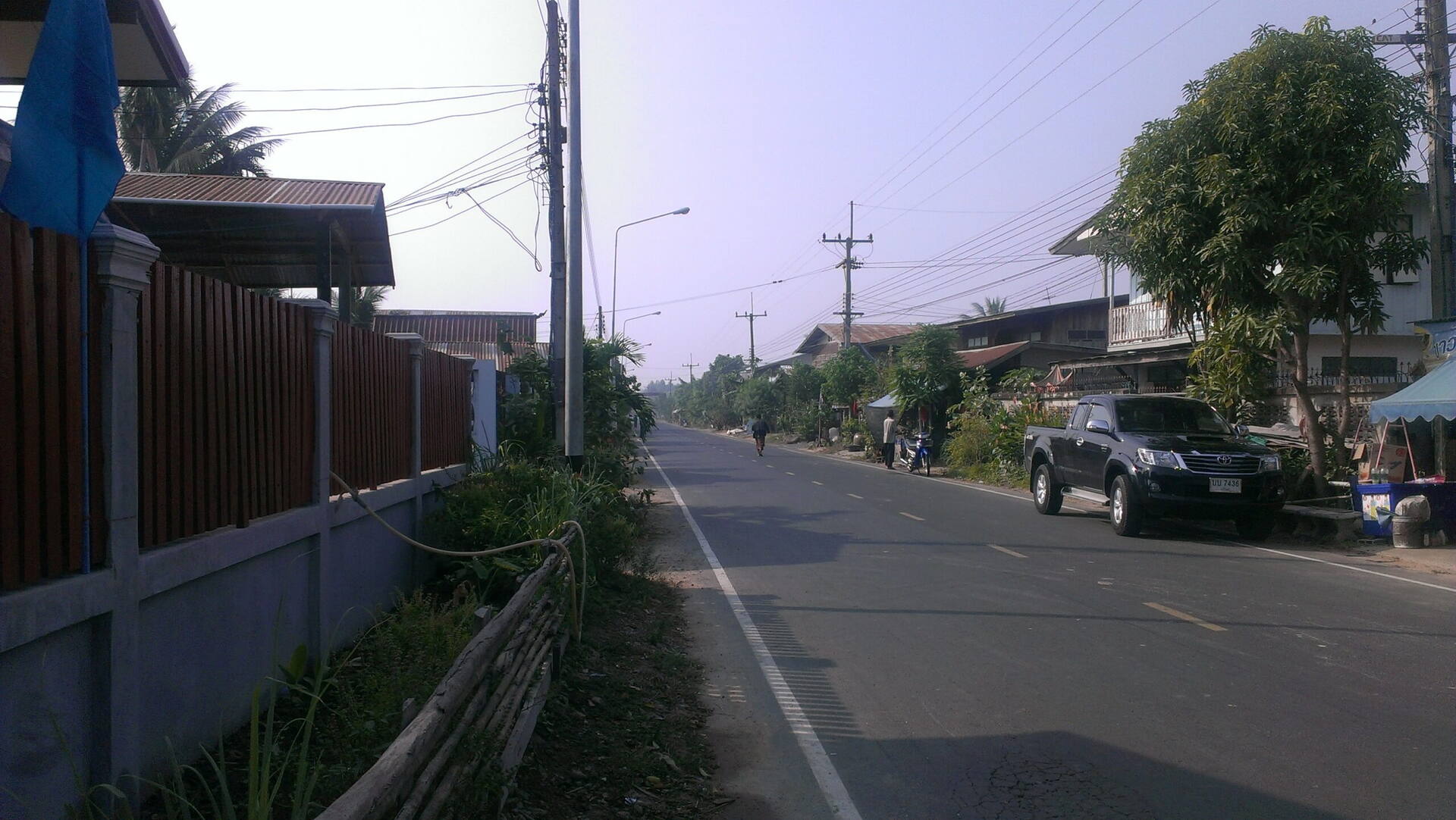 A quiet village road in Buriram province, Thailand