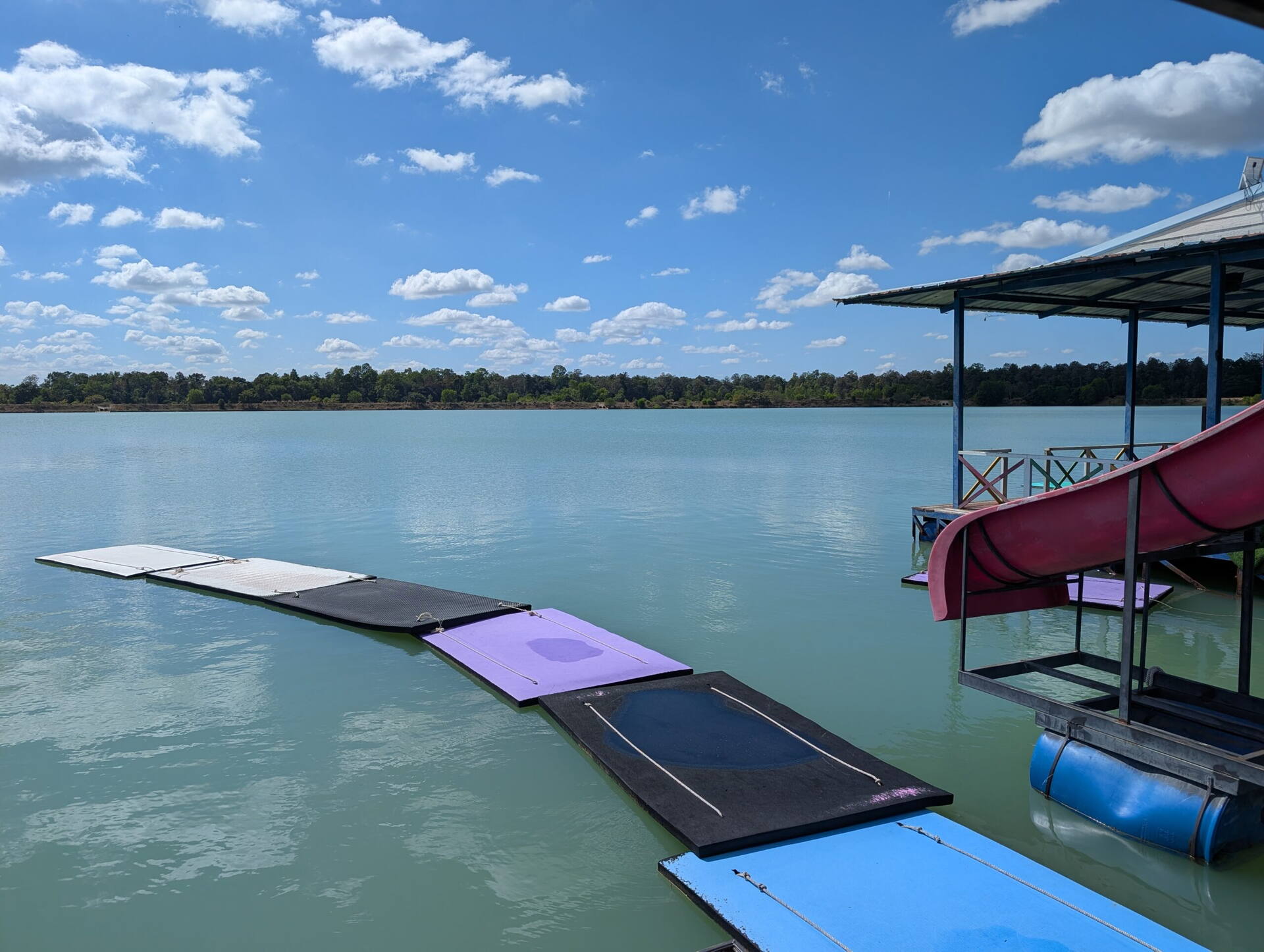 Floating raft platforms with water slides at Nong Tah Haeng lake, Buriram, Thailand