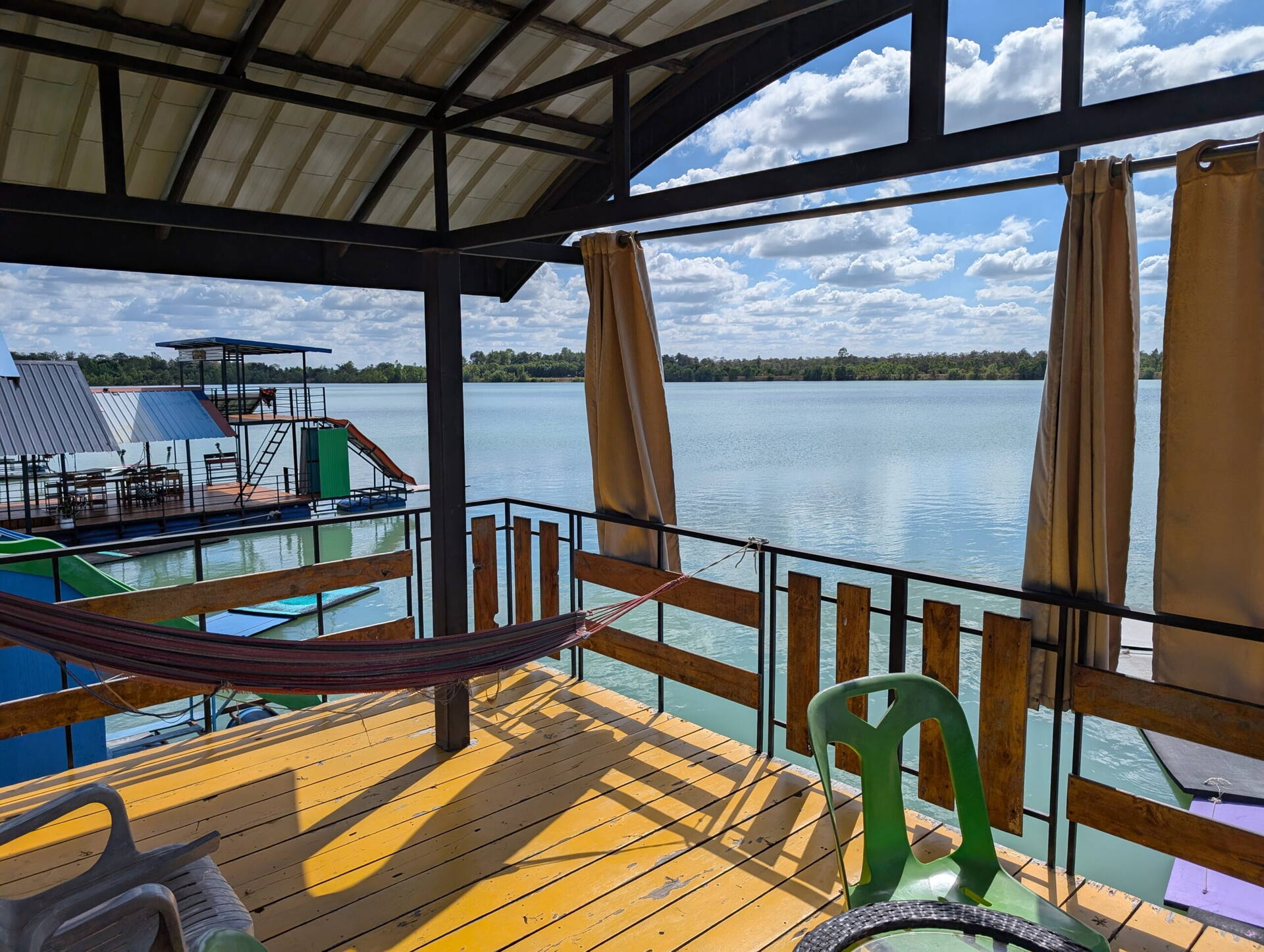 Raft deck with hammock overlooking Nong Tah Haeng lake, Buriram, Thailand