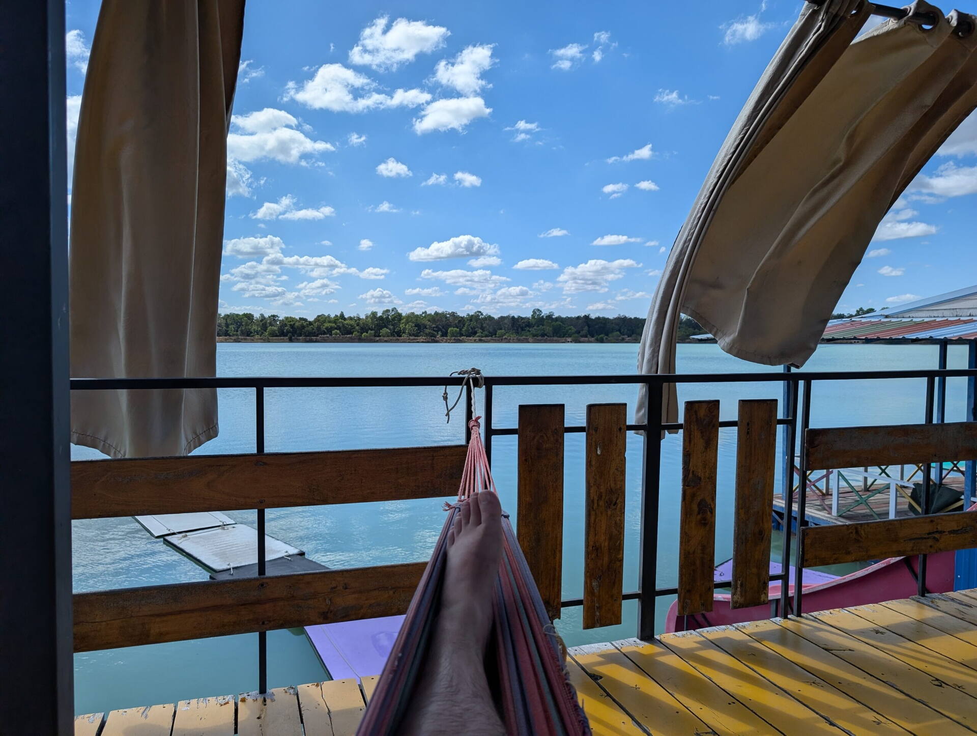 View of Nong Tah Haeng lake from a raft hammock, Buriram, Thailand